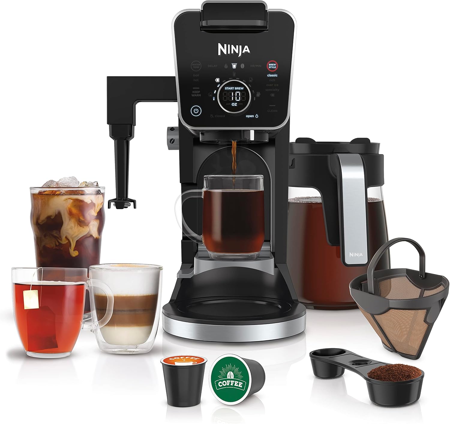 Sleek black and silver Ninja coffee maker with iced coffee, latte, hot coffee, tea, and accessories on white.