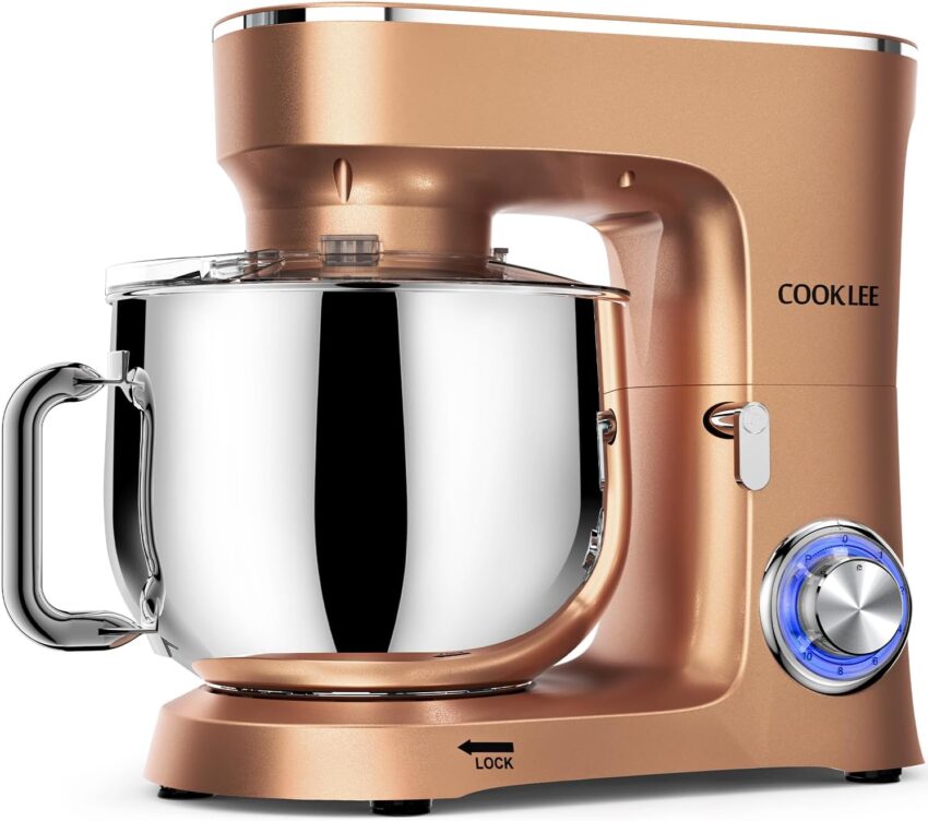 Sleek rose gold stand mixer with a reflective stainless steel bowl, clear splash guard, and matching whisk on a white background.