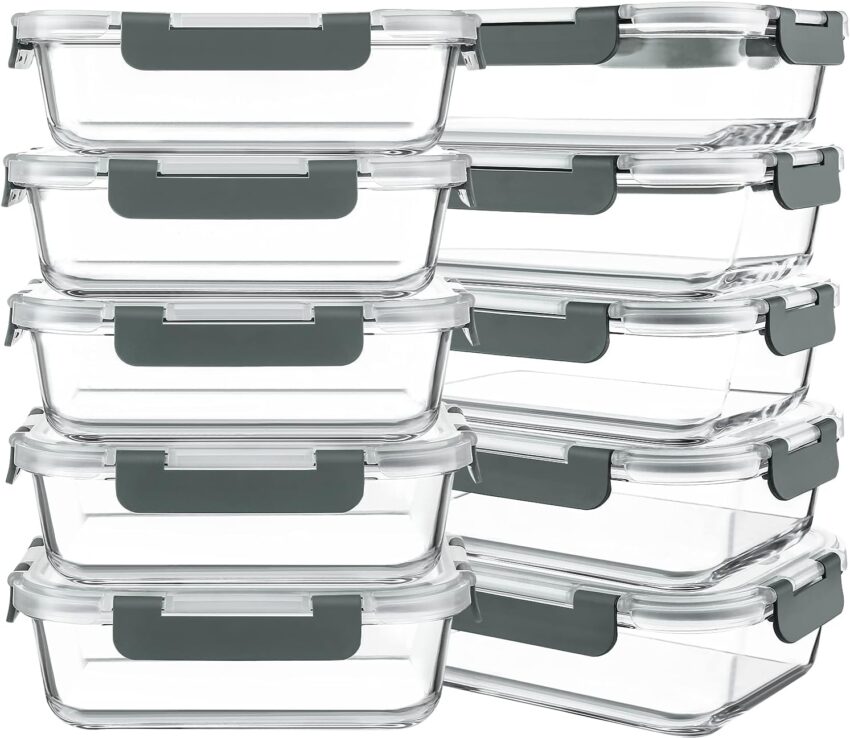 A collection of clear glass food storage containers with gray airtight locking lids in various shapes and sizes.
